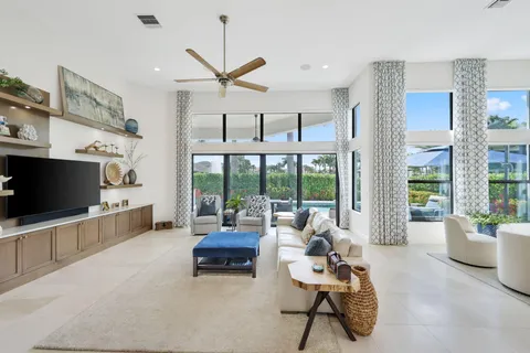 a living room with furniture and a piano