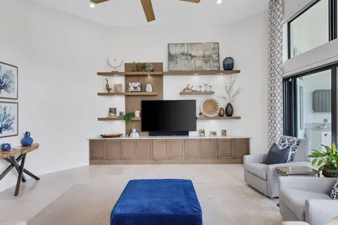 a bedroom with a bed and a chair