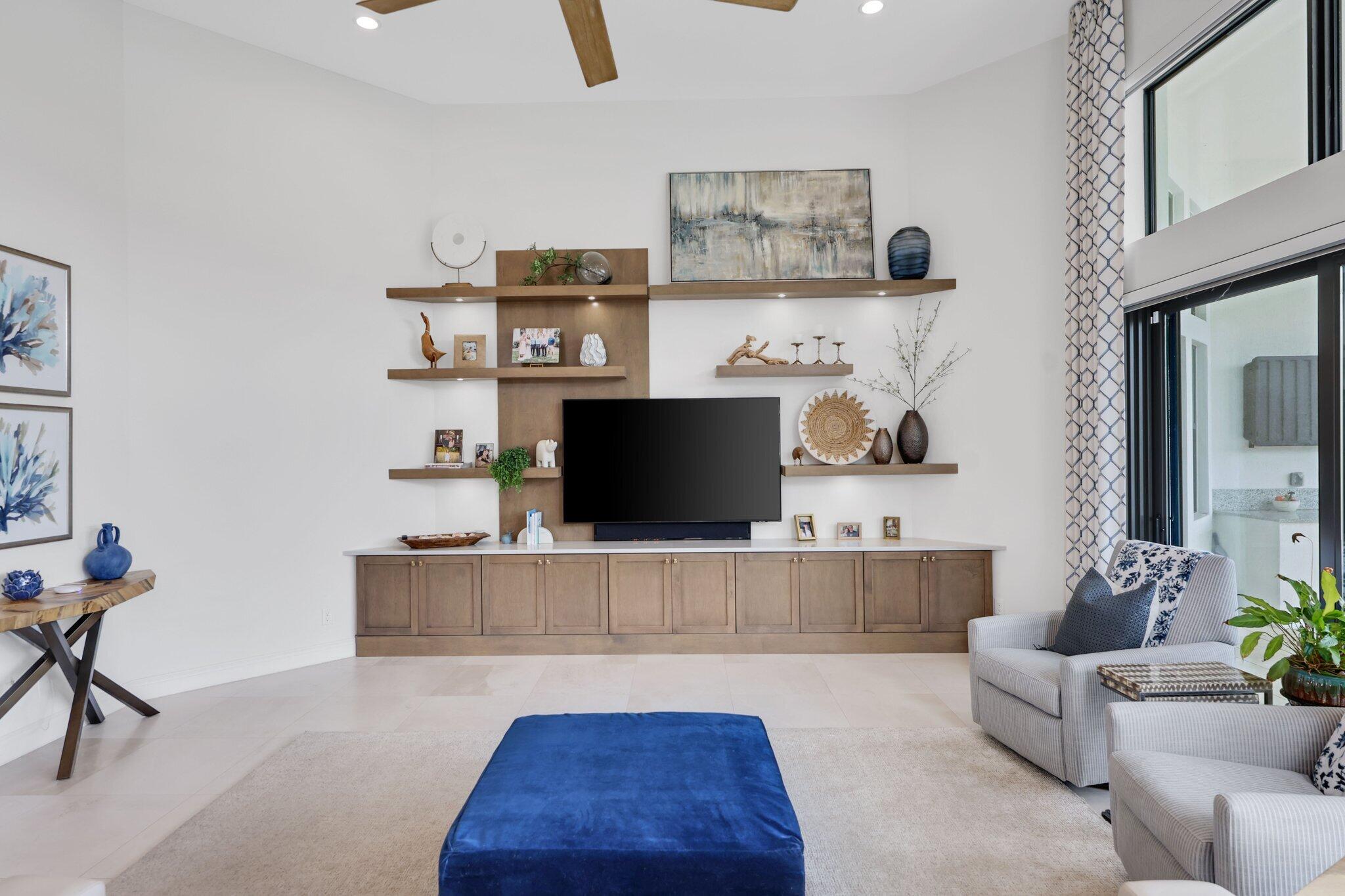 2530 Northwest 71st Street Boca Raton, FL 33496 - Photo 14 of 96 a living room with furniture and a flat screen tv