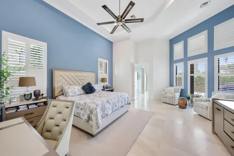 a balcony with furniture and a potted plant