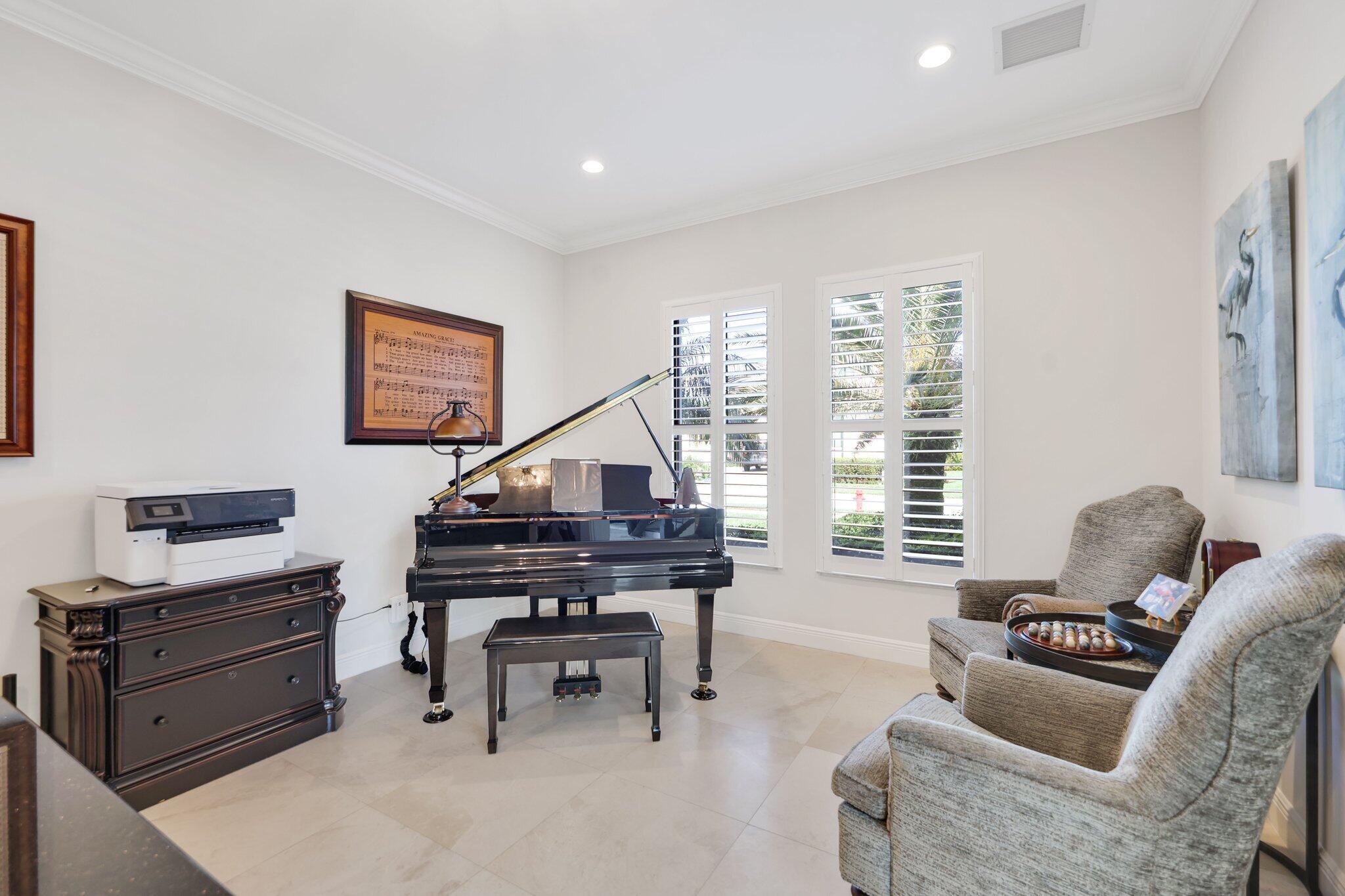 2530 Northwest 71st Street Boca Raton, FL 33496 - Photo 31 of 96 a living room with furniture and a piano
