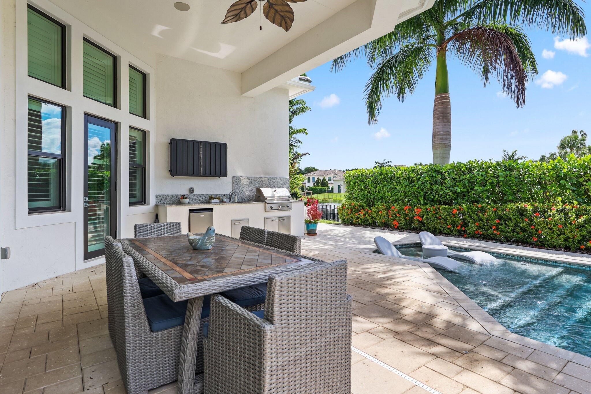 2530 Northwest 71st Street Boca Raton, FL 33496 - Photo 32 of 96 a outdoor space with furniture and a potted plant