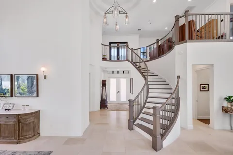 a view of entryway livingroom and hall with wooden floor