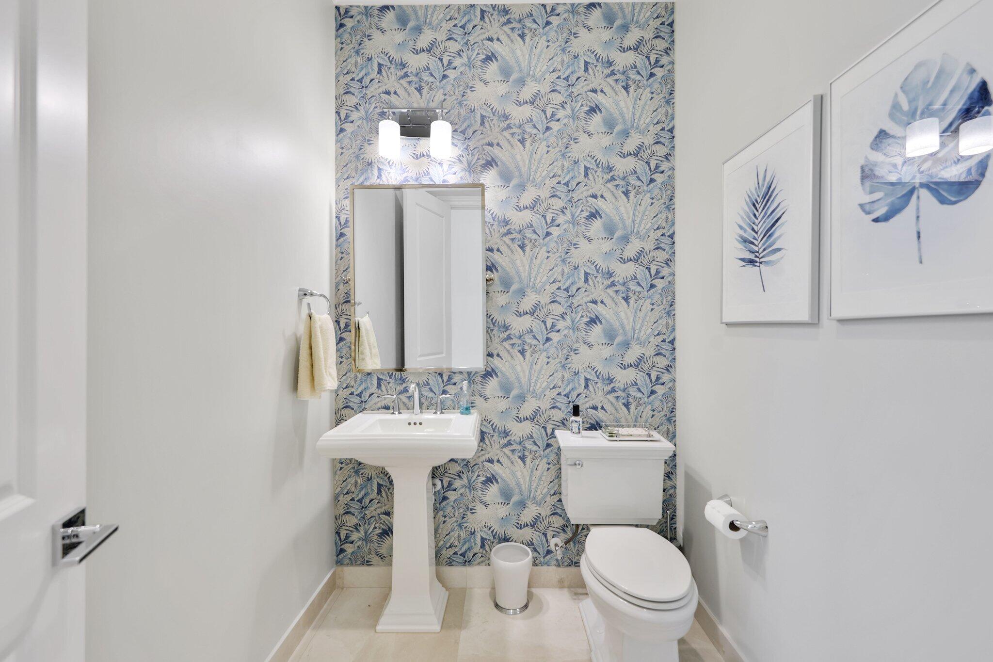 2530 Northwest 71st Street Boca Raton, FL 33496 - Photo 58 of 96 a bathroom with a toilet sink and mirror