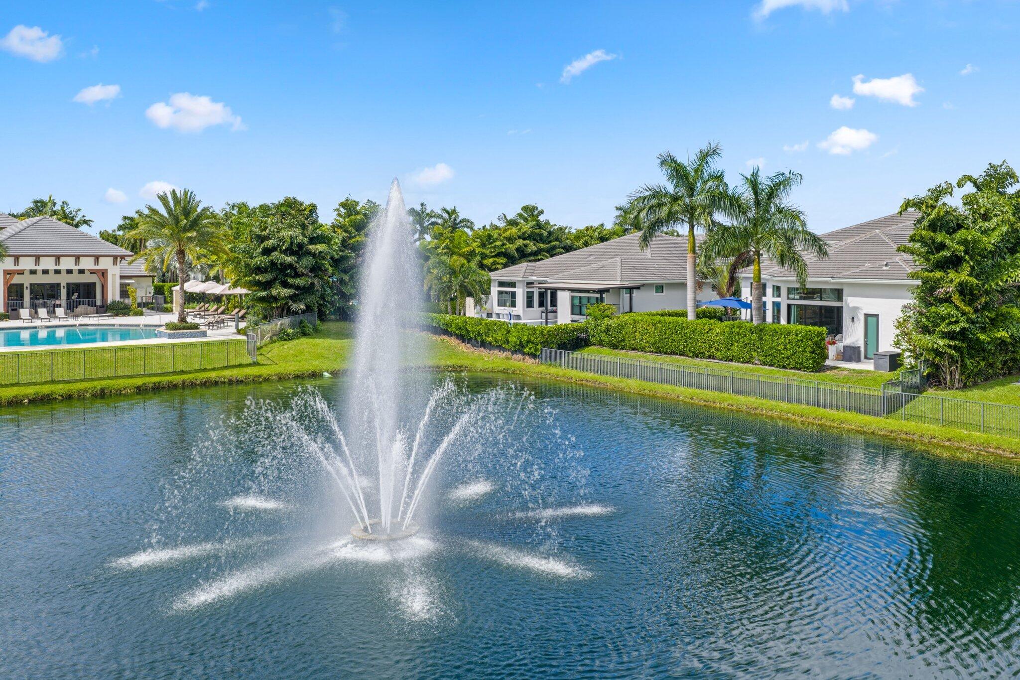 2530 Northwest 71st Street Boca Raton, FL 33496 - Photo 61 of 96 a view of a lake with a house in the background