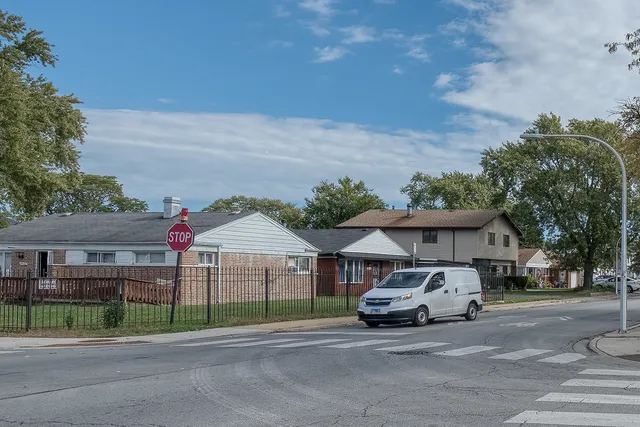 a view of a house next to a yard