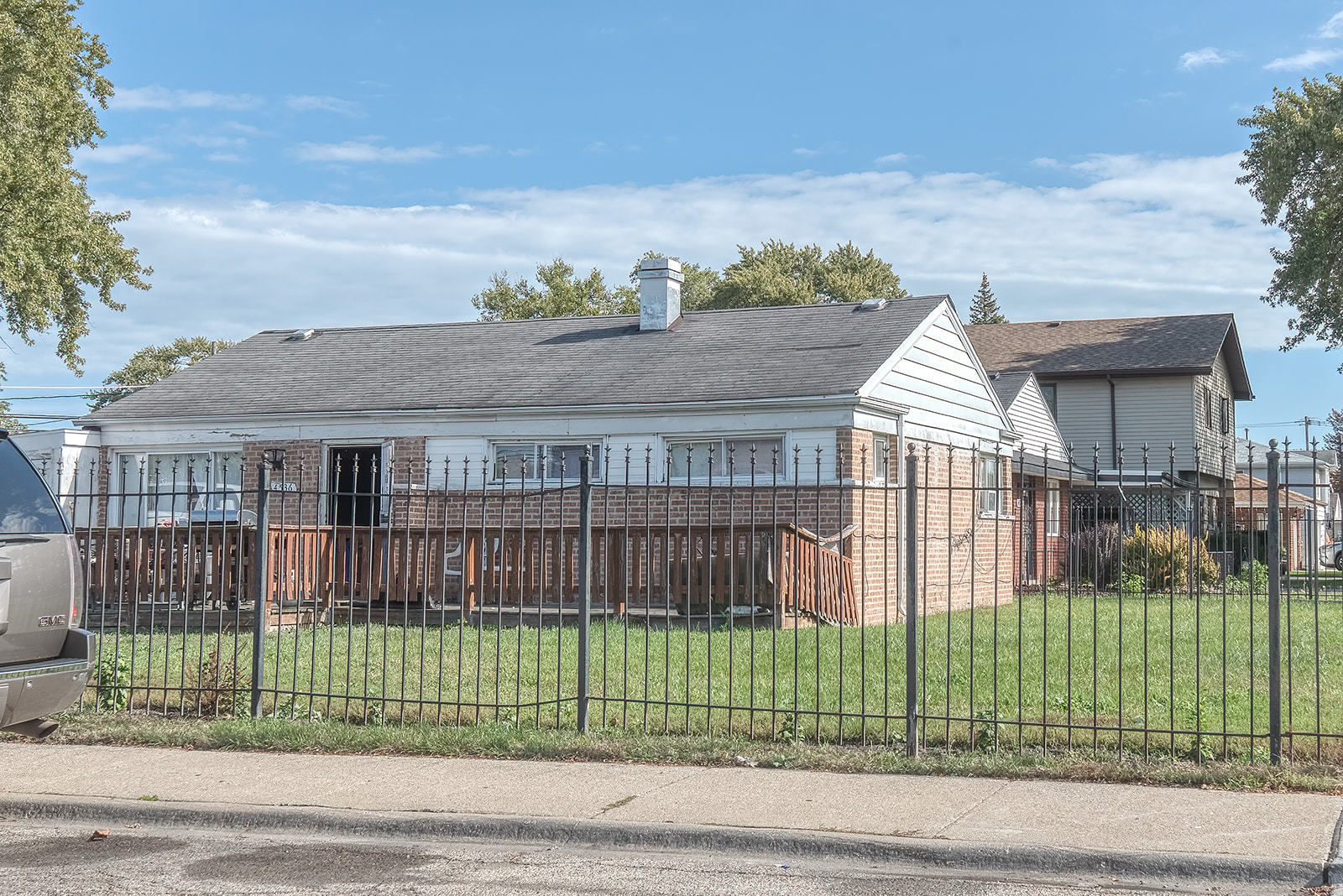 4536 West 83rd Street Chicago, IL 60652 - Photo 5 of 6 a front view of a house with a garden and plants