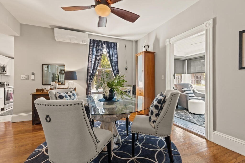 a dining room with furniture and window