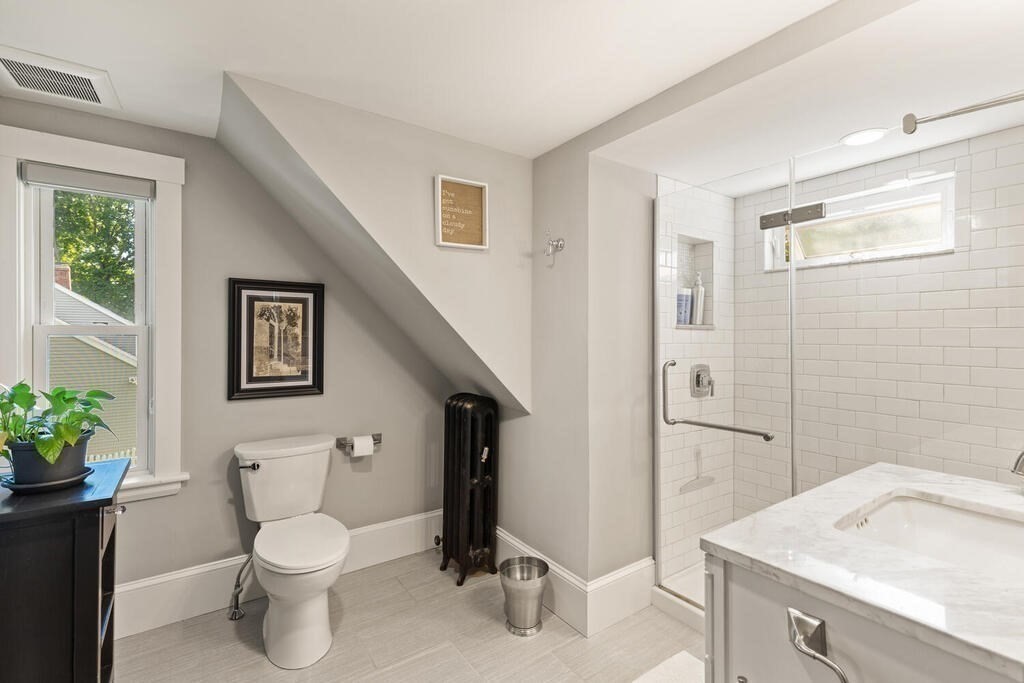 33 Porter Street, Unit 33 Woburn, MA 01801 - Photo 16 of 25 a bathroom with a sink toilet and shower