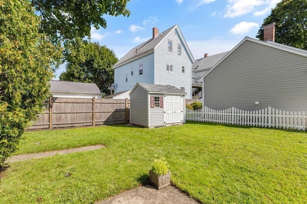 33 Porter Street, Unit 33 Woburn, MA 01801 - Photo 22 of 25 a view of a house with a yard