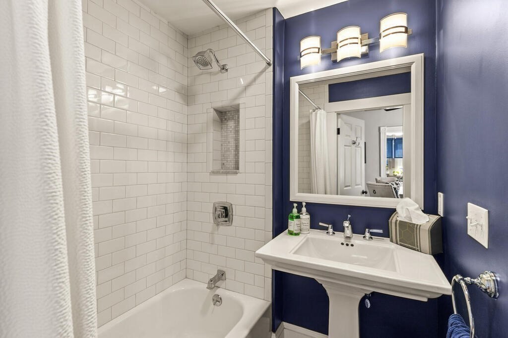 33 Porter Street, Unit 33 Woburn, MA 01801 - Photo 8 of 25 a bathroom with a sink vanity and a mirror