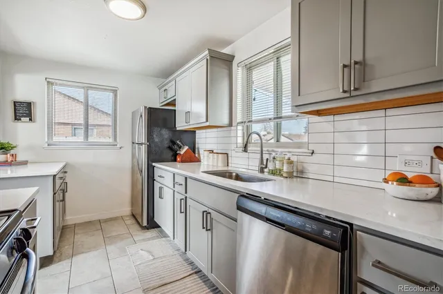 a kitchen with a sink cabinets and window