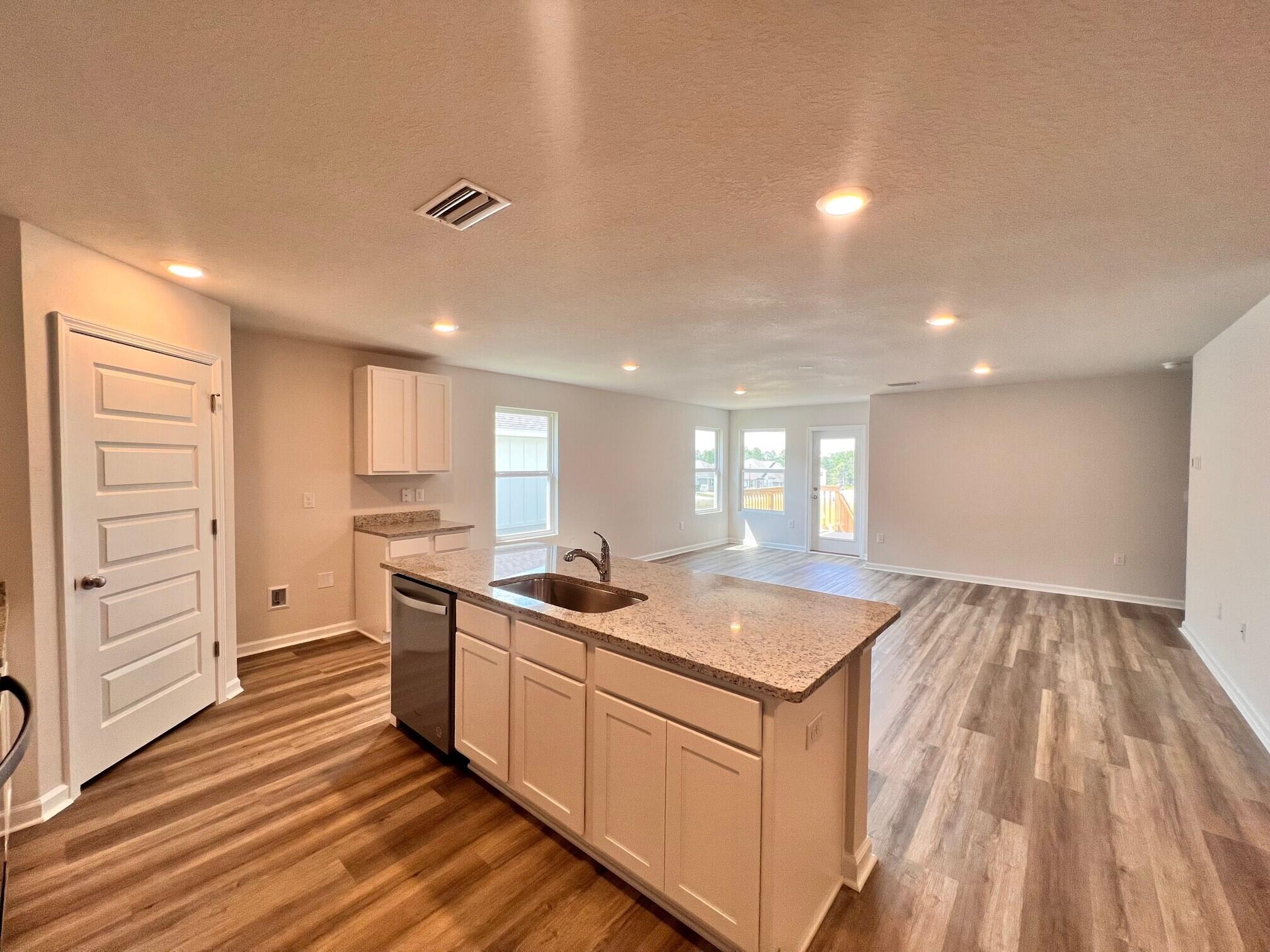 537 Mary Lou Way Crestview, FL 32539 - Photo 6 of 20 a kitchen with a sink stove and cabinets