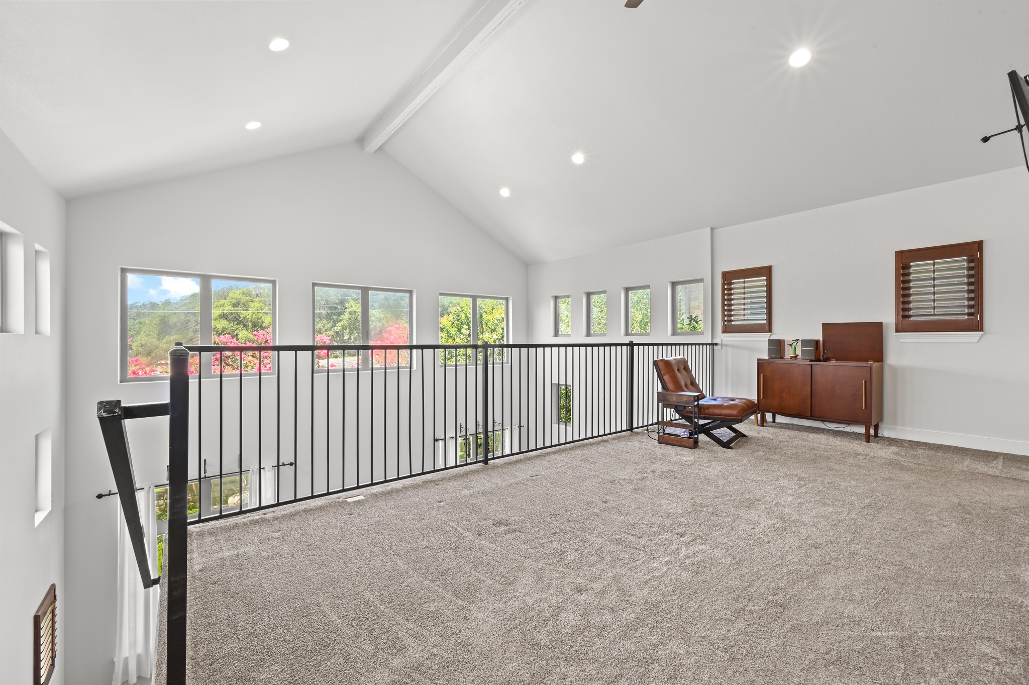592 Farm To Market 967, Unit B Buda, TX 78610 - Photo 17 of 26 Overlooking the main living area, this versatile loft is filled with natural light and offers endless possibilities—perfect for a home office, media room, workout space, or cozy retreat.