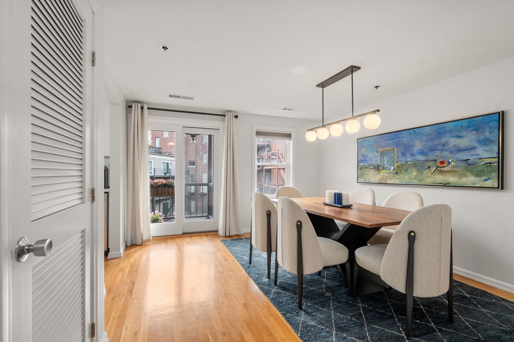 a dining room with furniture and window