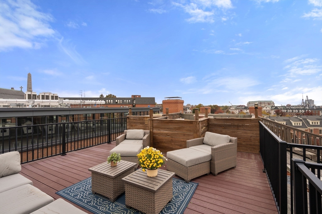 17 Henley Street, Unit F Boston, MA 02129 - Photo 16 of 19 a view of a terrace with couches