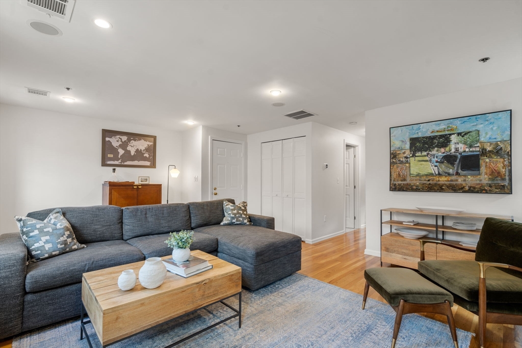 17 Henley Street, Unit F Boston, MA 02129 - Photo 2 of 19 a living room with furniture and a couch