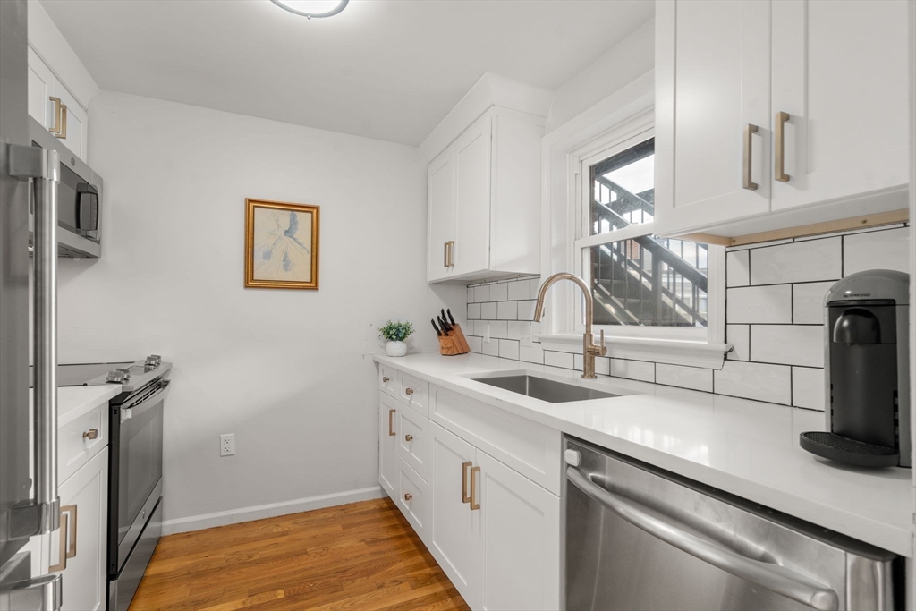 17 Henley Street, Unit F Boston, MA 02129 - Photo 5 of 19 a kitchen with a sink and cabinets