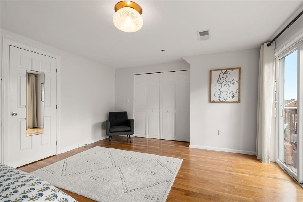 17 Henley Street, Unit F Boston, MA 02129 - Photo 10 of 19 a view of a room with wooden floor and windows