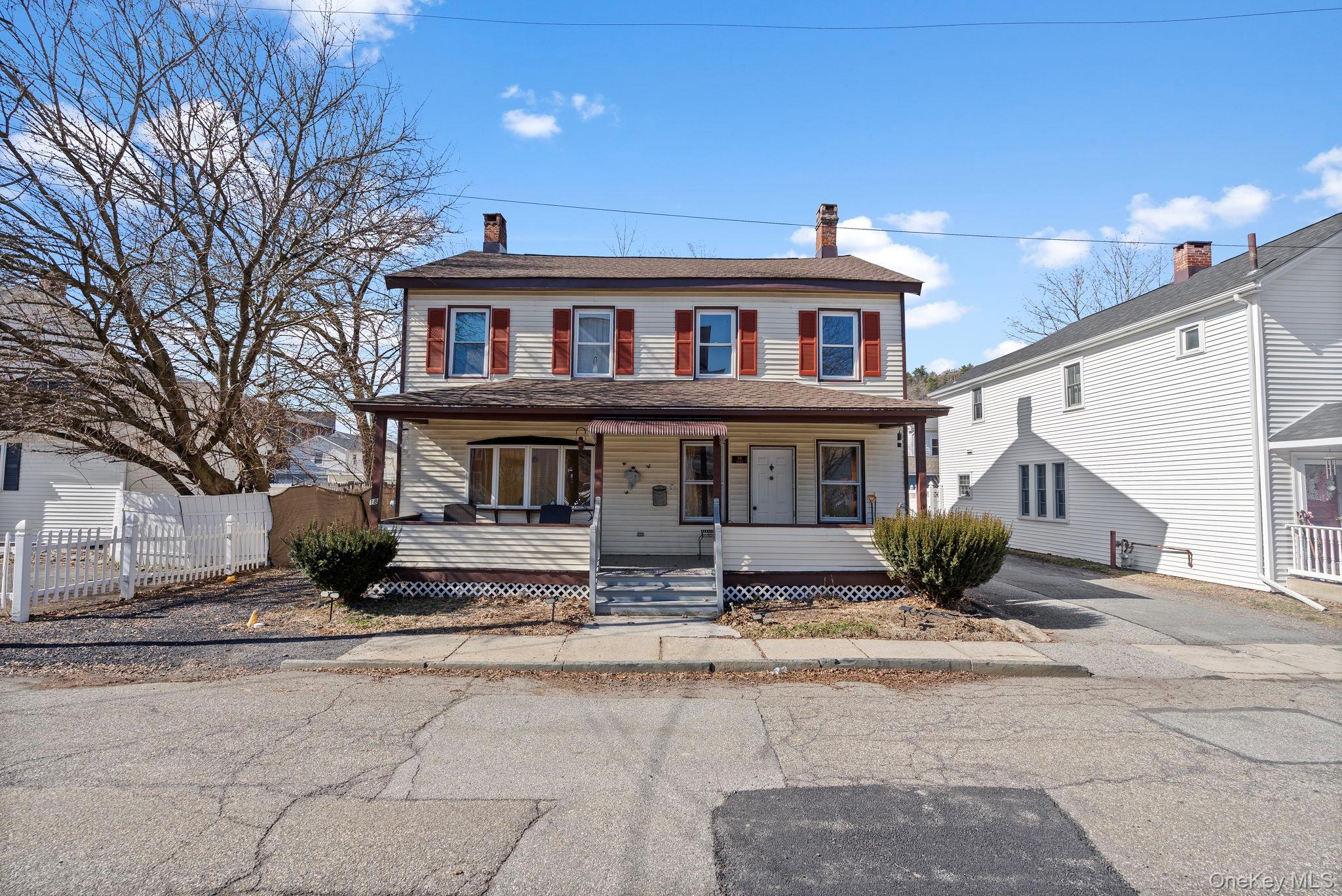18-20 Spring Street Port Jervis, NY 12771 - Photo 1 of 46 a front view of house with a yard