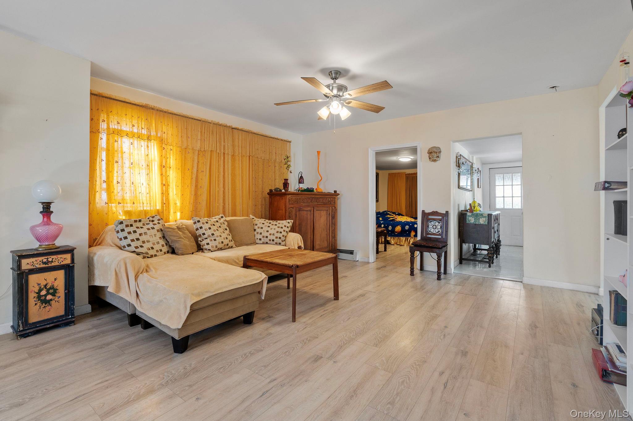 18-20 Spring Street Port Jervis, NY 12771 - Photo 19 of 46 a living room with furniture and a wooden floor