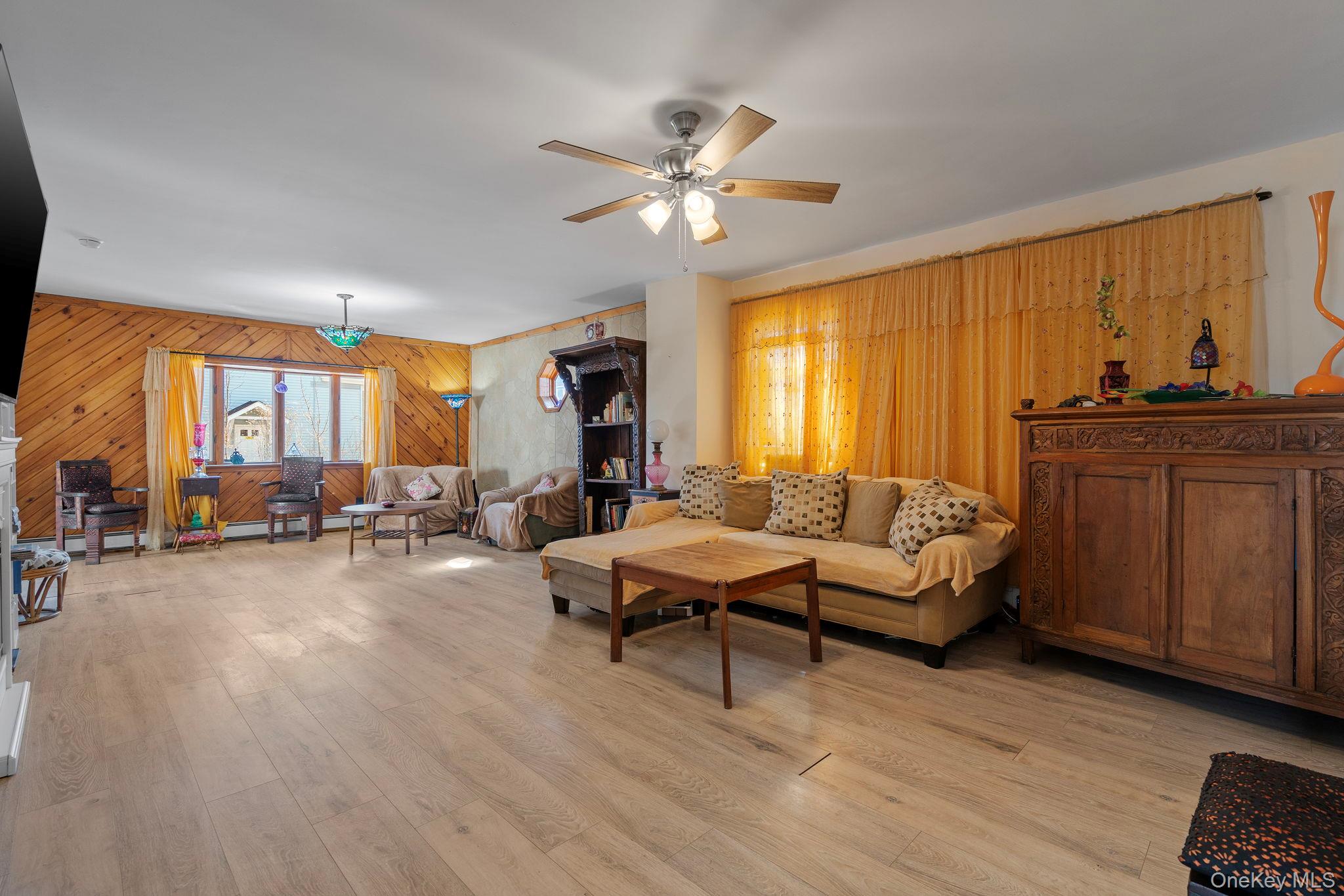 18-20 Spring Street Port Jervis, NY 12771 - Photo 21 of 46 a living room with furniture and a large window