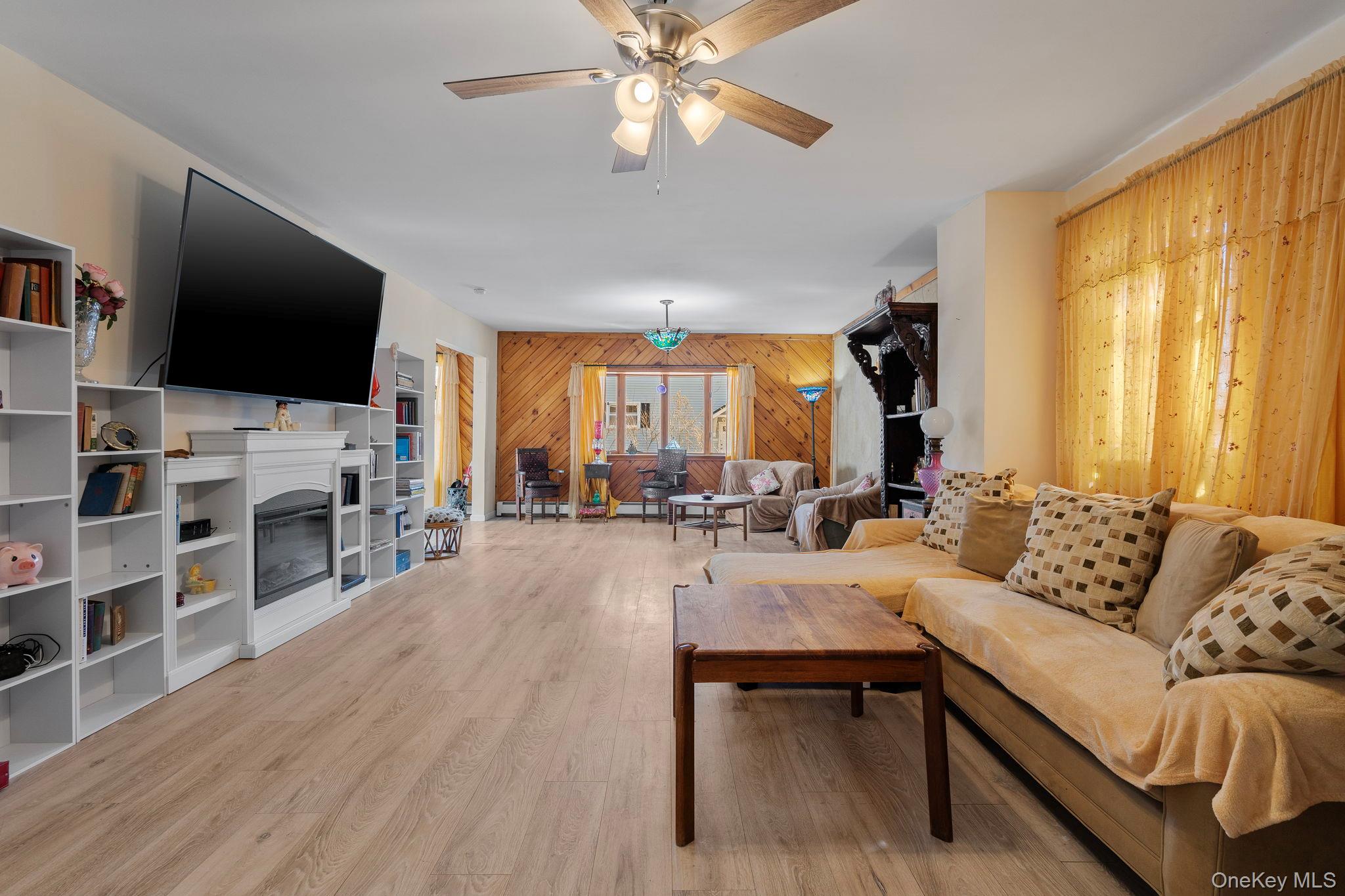 18-20 Spring Street Port Jervis, NY 12771 - Photo 22 of 46 a living room with furniture and a flat screen tv