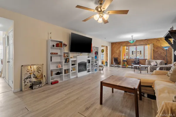 a view of a livingroom with furniture and a flat screen tv