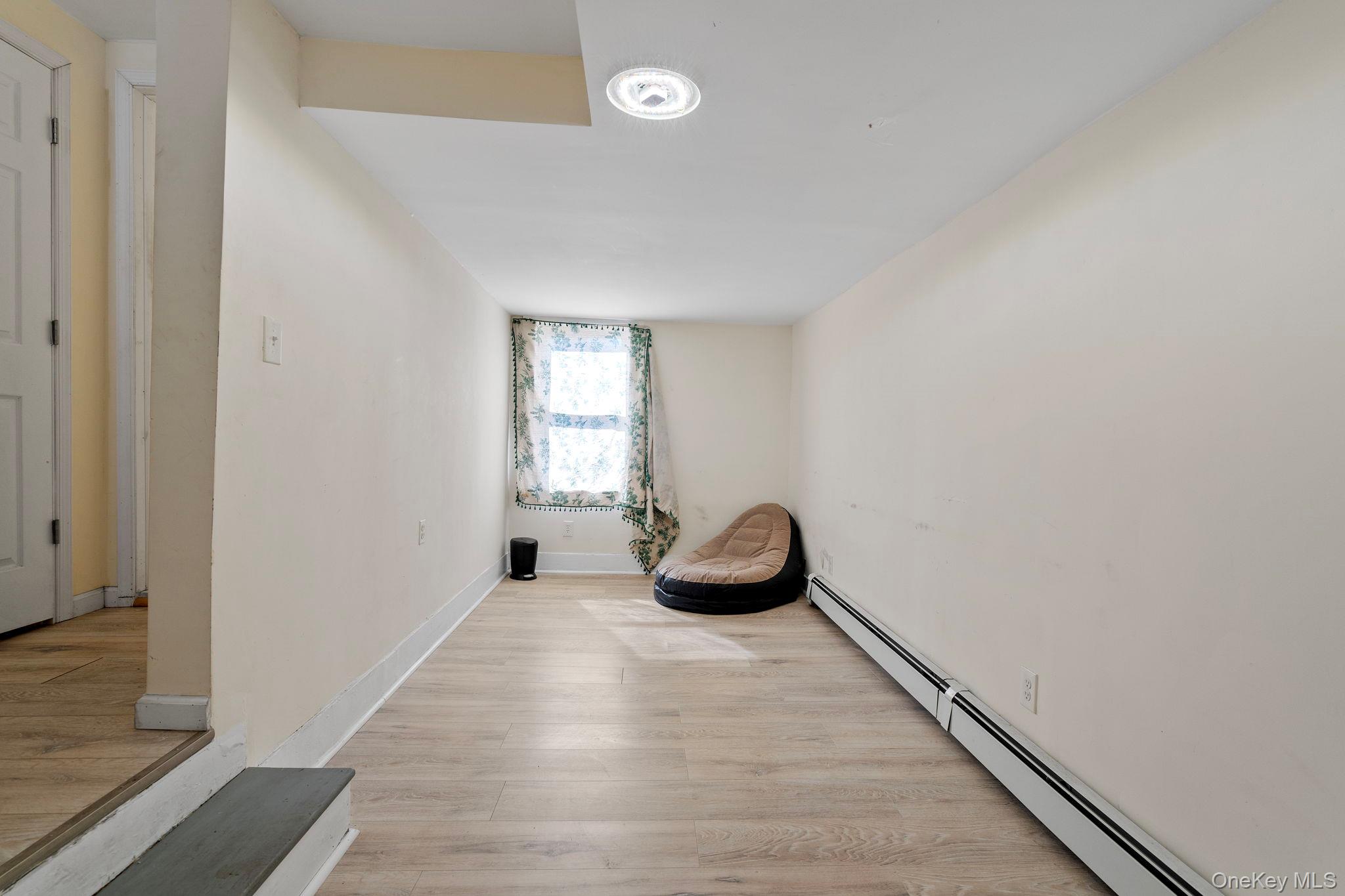 18-20 Spring Street Port Jervis, NY 12771 - Photo 30 of 46 an empty room with windows