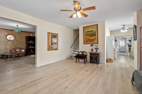 a view of a livingroom with furniture and a flat screen tv