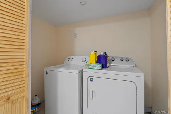 a utility room with dryer and washer