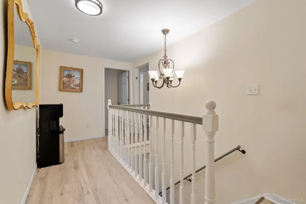 a view of a hallway with front door