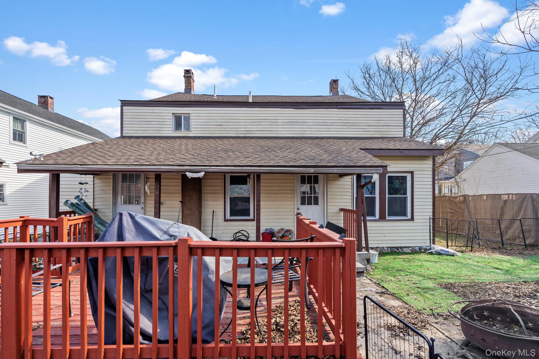 18-20 Spring Street Port Jervis, NY 12771 - Photo 37 of 46 a front view of house with yard and outdoor seating