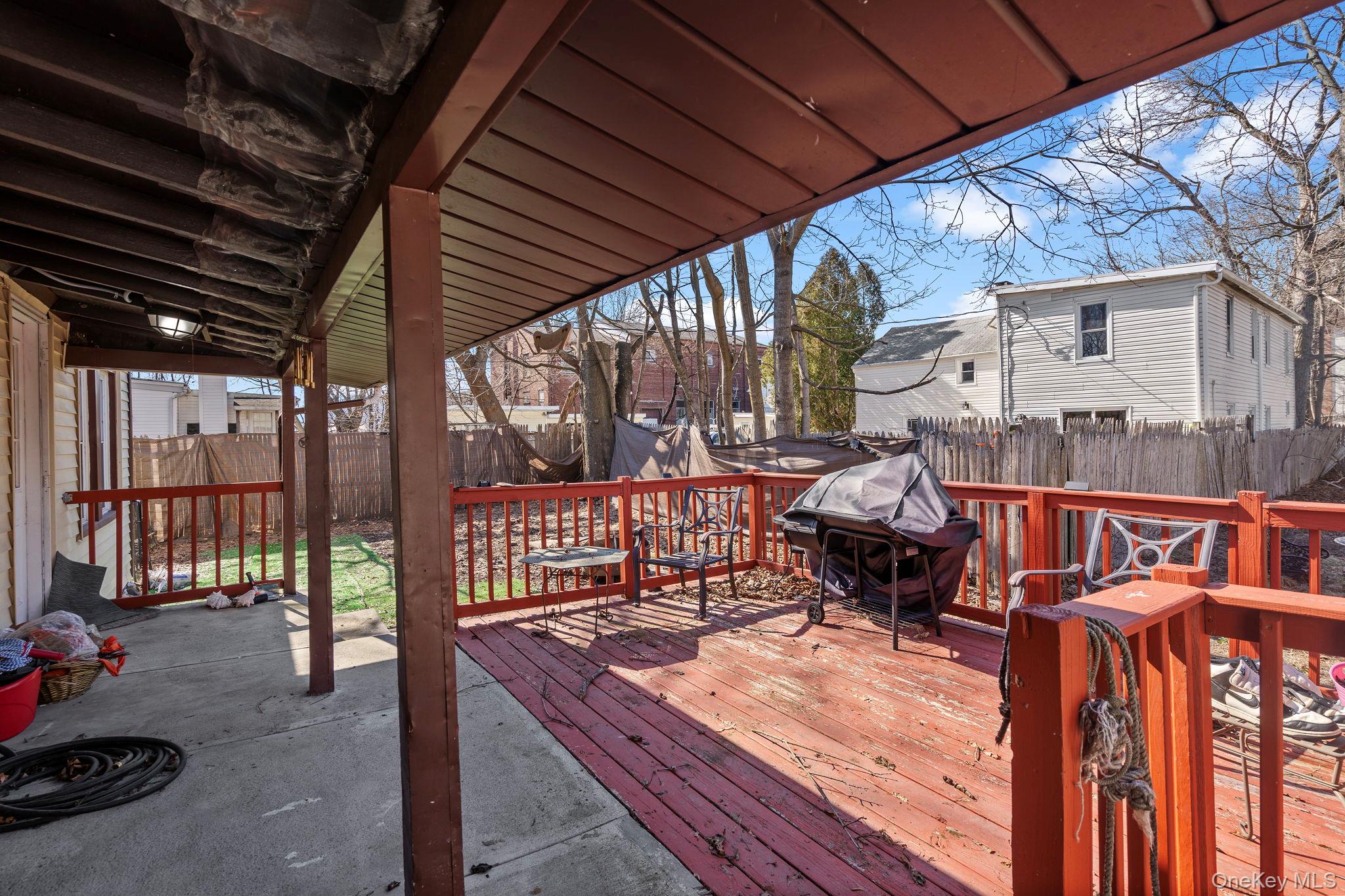 18-20 Spring Street Port Jervis, NY 12771 - Photo 39 of 46 a roof deck with table and chairs and wooden floor