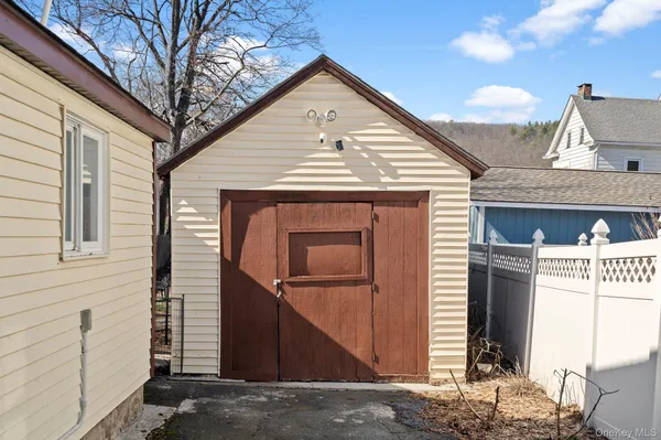 a front view of a house with garage