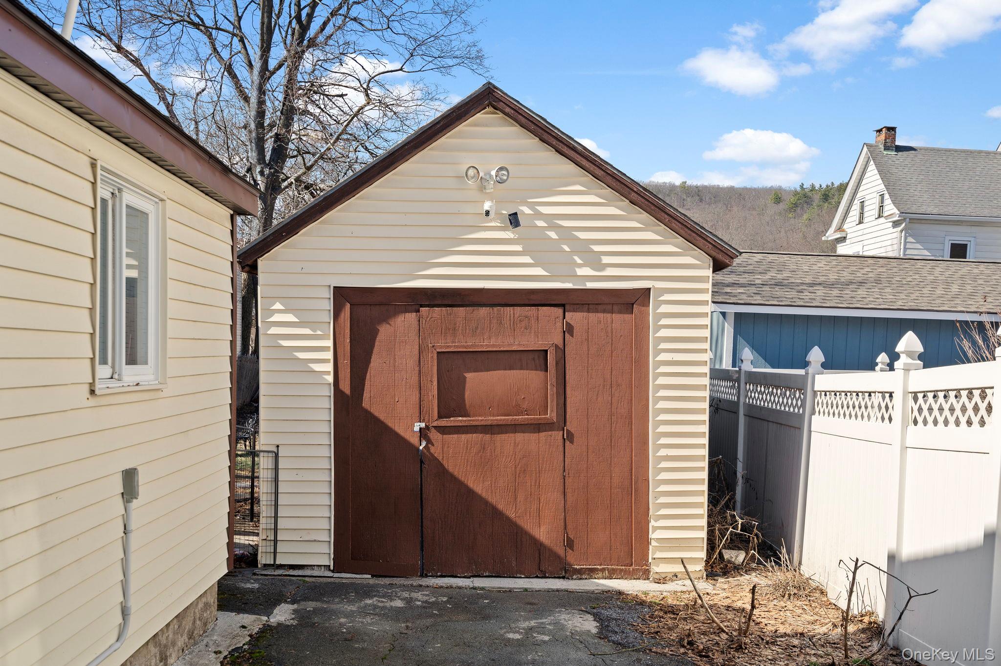 18-20 Spring Street Port Jervis, NY 12771 - Photo 46 of 46 a front view of a house with garage