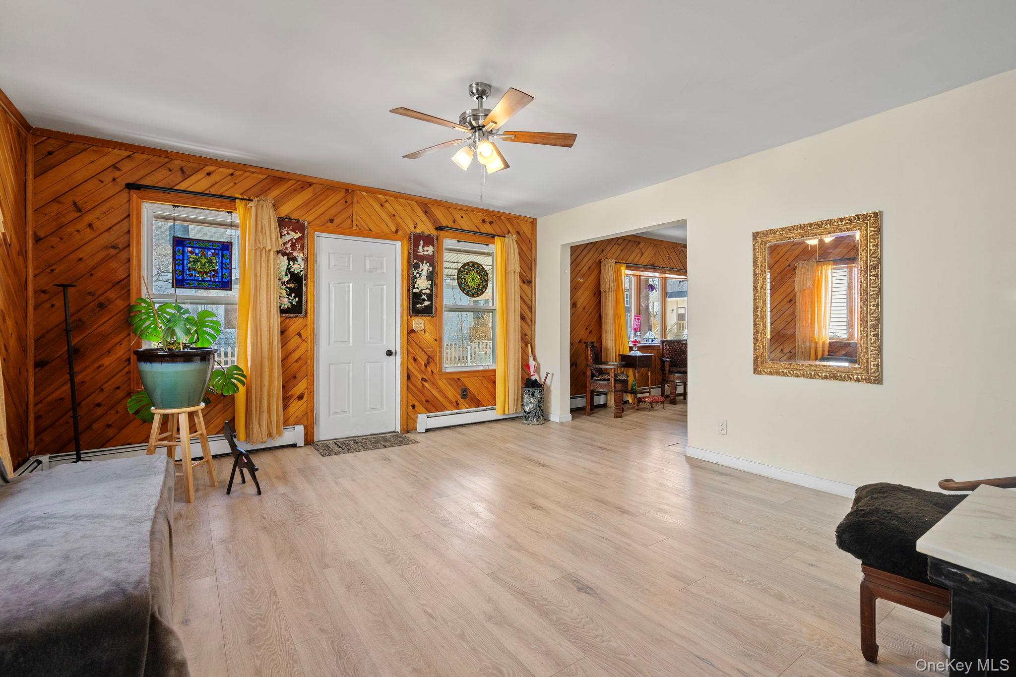 18-20 Spring Street Port Jervis, NY 12771 - Photo 6 of 46 a view of a livingroom with furniture and hardwood floor