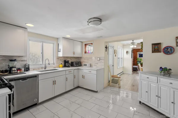 a kitchen with sink and cabinets