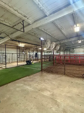 a view of an empty room with gym equipment
