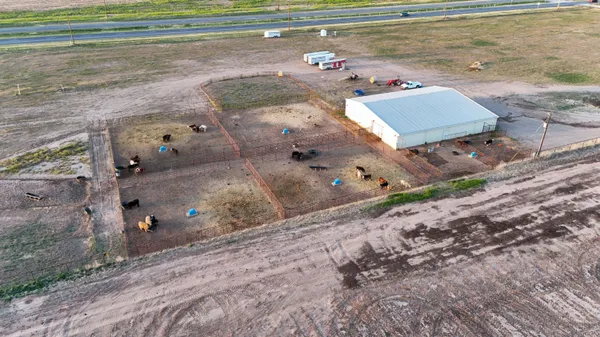 a aerial view of a house with a yard
