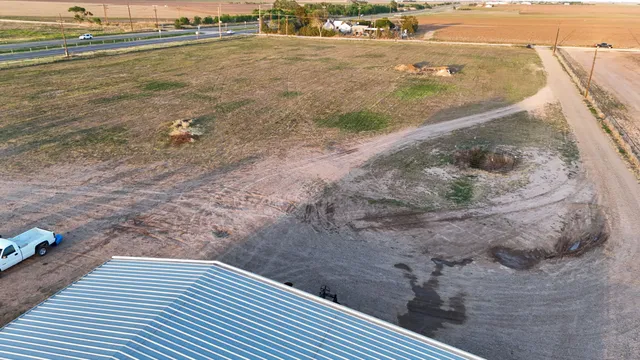 an aerial view of a house with ocean view