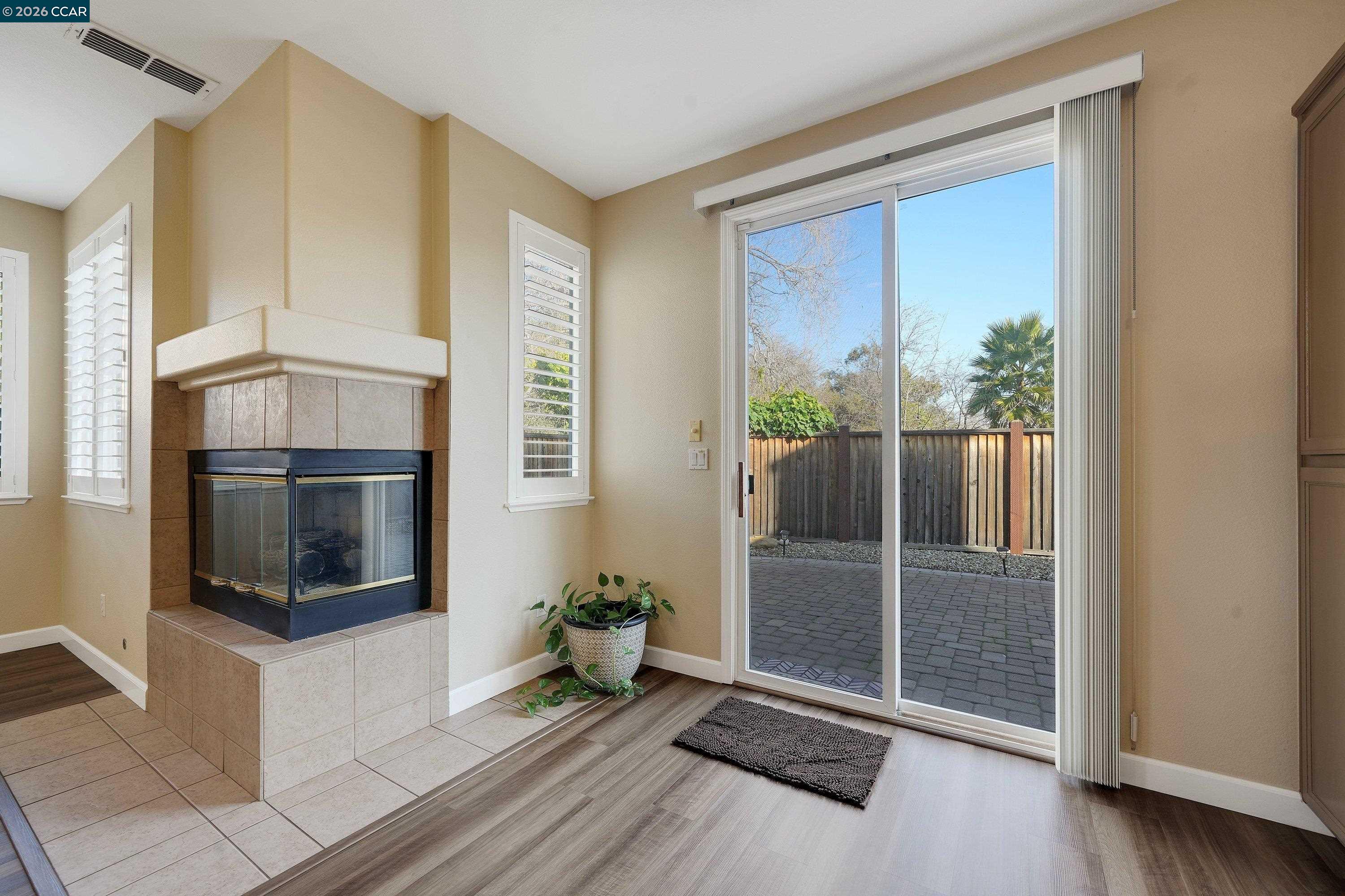 738 Marsh Place Fairfield, CA 94533 - Photo 17 of 45 a living room with a fireplace and a flat screen tv