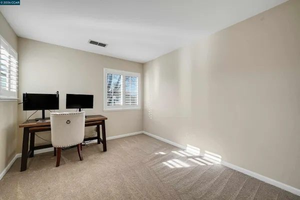 a workspace with furniture and window