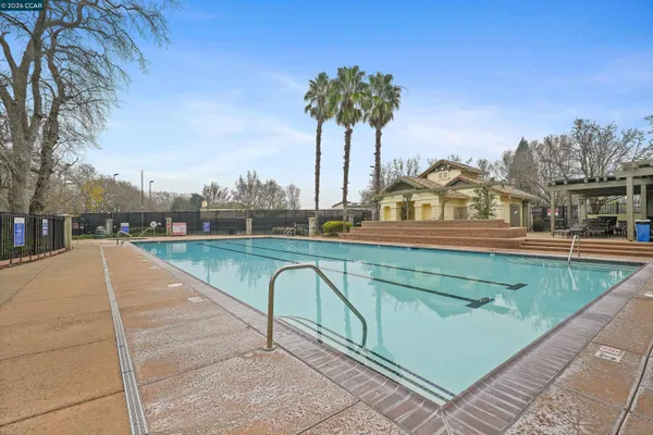 a view of a swimming pool with a lake view