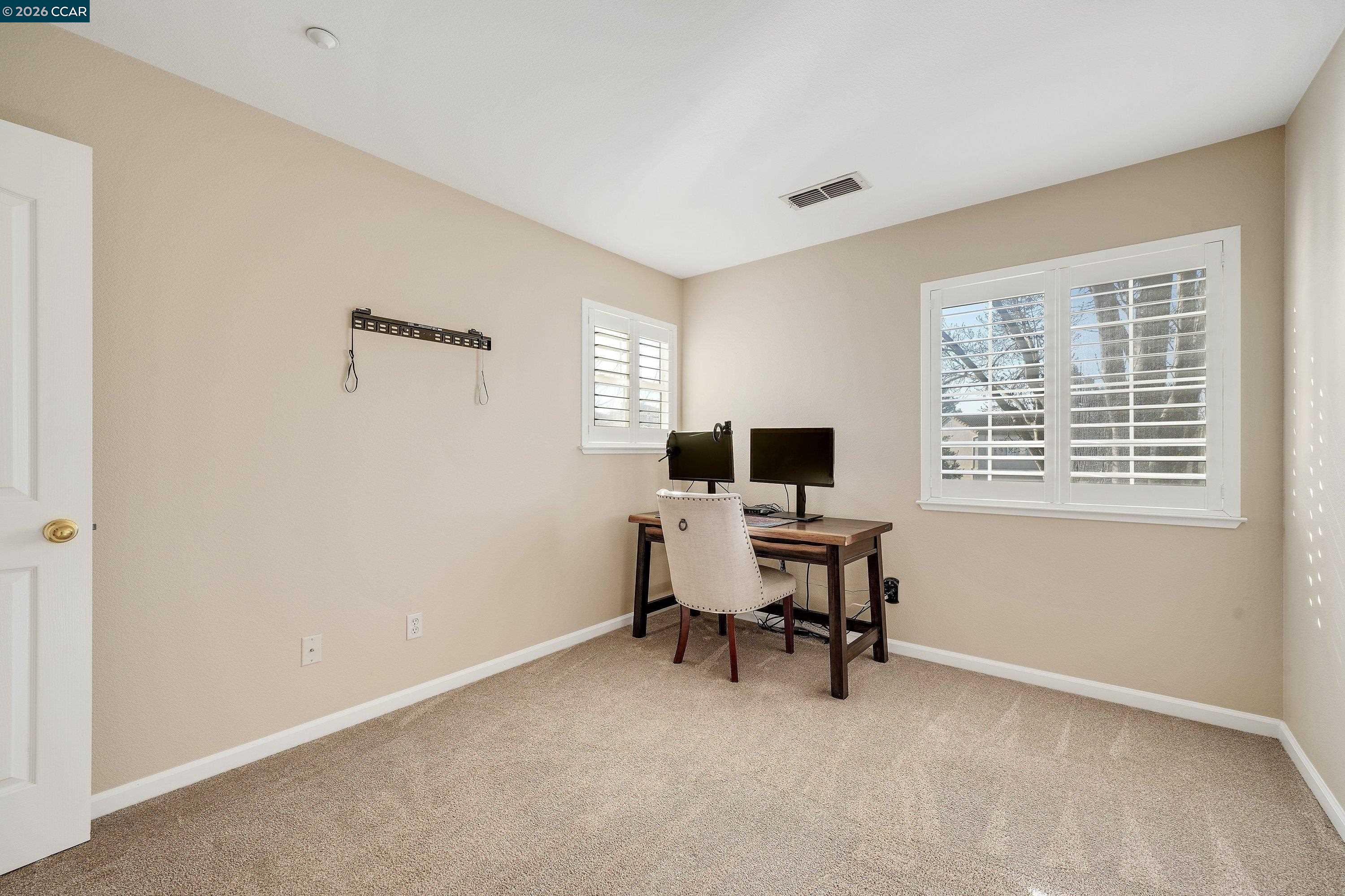 738 Marsh Place Fairfield, CA 94533 - Photo 32 of 45 a view of a workspace with furniture and a window