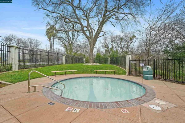 a view of a swimming pool with a backyard