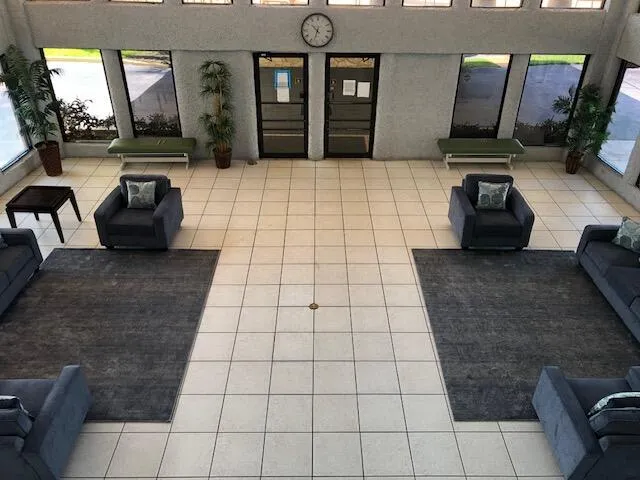 a view of a swimming pool with a lounge chair