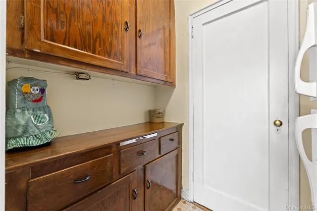 a view of a storage and utility room with closet