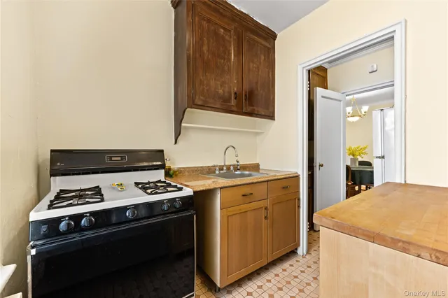 a kitchen with a stove and a sink