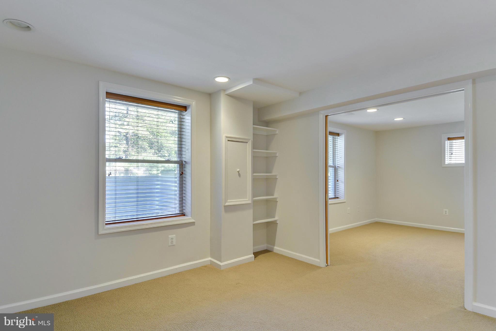 9500 Reach Road Potomac, MD 20854 - Photo 25 of 30 Lower level bedroom connect to den - pocket doors